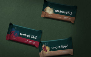 Undressed Savory Salad Bars shown in 4 delicious flavors: Miso Ginger, Berry Balsamic, and Spicy Southwest. 